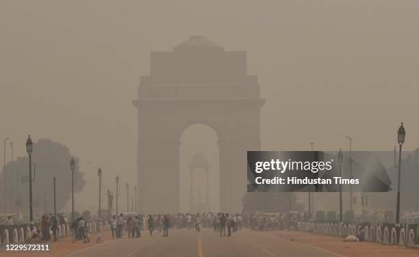 Heavy smog with pollution covered India Gate in morning, on November 10, 2020 in New Delhi, India. Visibility reduced in parts of the national...