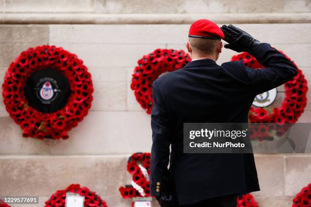 An army veteran salutes at the Cenotaph following an Armistice Day service at the memorial on Whitehall in London, England, on November 11, 2020.