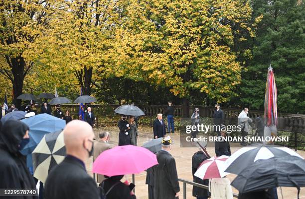 President Donald Trump arrives with First Lady Melania Trump as he attends a "National Day of Observance" wreath laying ceremony on November 11, 2020...