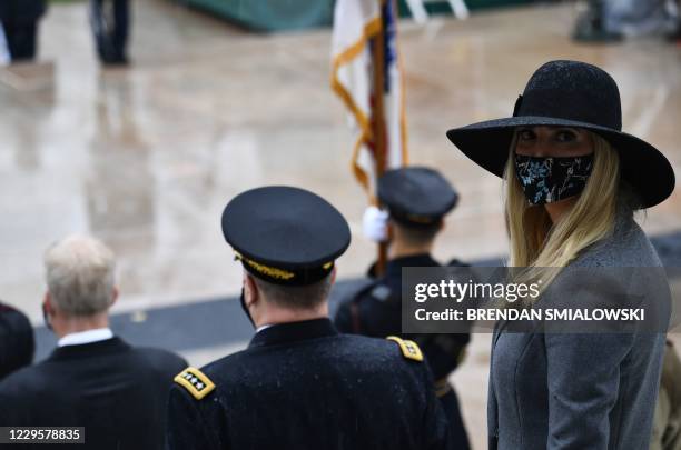 Daughter and Senior Advisor to the US President Ivanka Trump looks on as US President Donald Trump arrives for a "National Day of Observance" wreath...