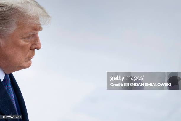 President Donald Trump arrives for a wreath laying ceremony at the Tomb of the Unknown Soldier on Veterans Day at Arlington National Cemetery in...