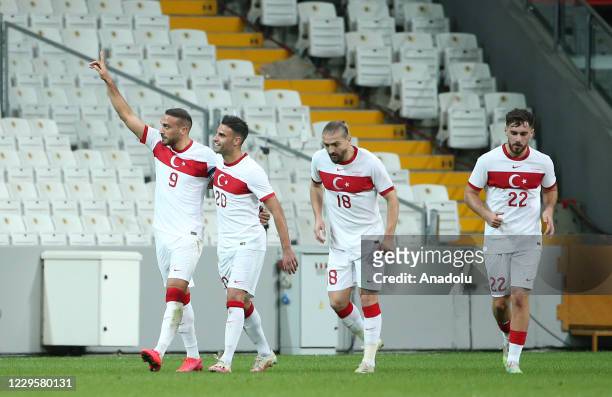 Players of Turkey National Football Team celebrate after Cenk Tosun scores a goal during a friendly match between the national football teams of...