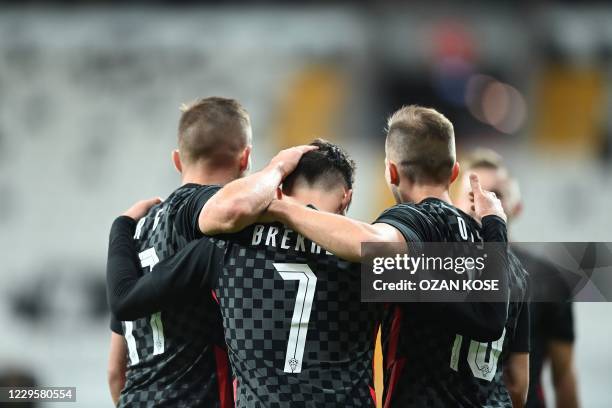 Croatia's forward Josip Brekalo celebrates with teammates after scoring during the friendly football match between Turkey and Croatia at the Vodafone...