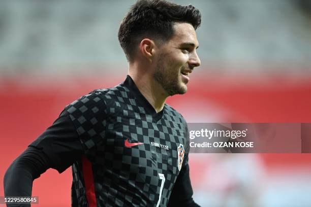 Croatia's forward Josip Brekalo celebrates after scoring during the friendly football match between Turkey and Croatia at the Vodafone Park in...