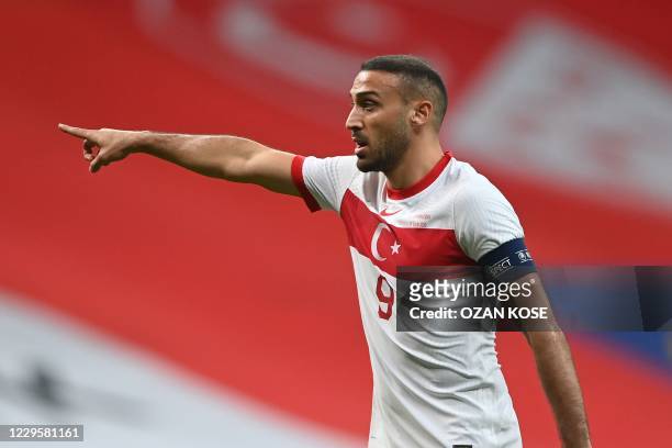 Turkey's forward Cenk Tosun gestures during the friendly football match between Turkey and Croatia at the Vodafone Park in Istanbul on November 11,...