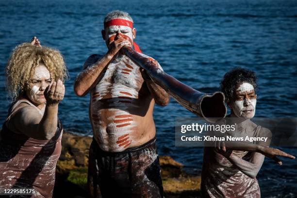 Nov. 11, 2020 -- Aboriginal people dance at Sydney harbour, Australia, Nov. 11, 2020. Australia on Sunday kicked off a week of celebrations...