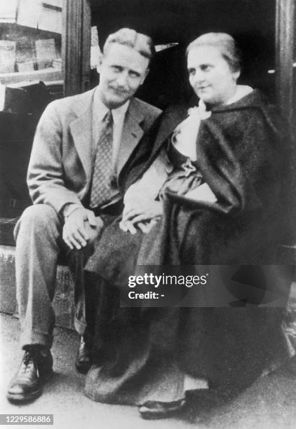 Undated picture of Francis Scott Fitzgerald and Adrienne Monnier sat on the steps of the "Sylvia Beach" shop.
