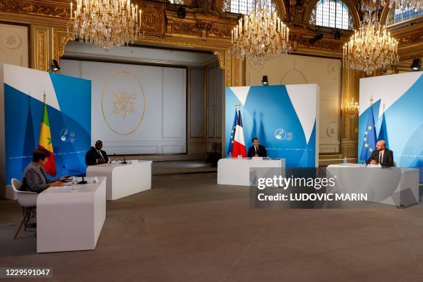 French President Emmanuel Macron , European Council President Charles Michel , Senegal's President Macky Sall and International Monetary Fund...
