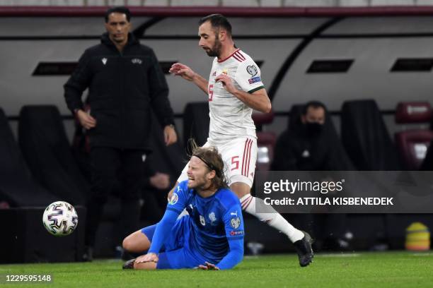 Iceland's midfielder Birkir Bjarnason and Hungary's defender Attila Fiola vie for the ball during the UEFA European Qualifiers play-off final...