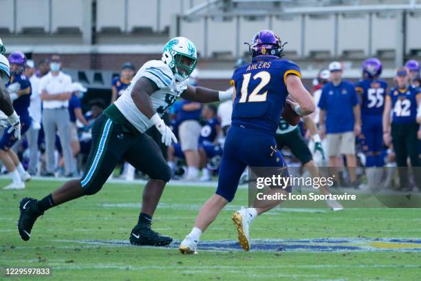 East Carolina Pirates Defensive Lineman Elijah Robinson pressures East Carolina Pirates Quarterback Holton Ahlers during the second half of the...