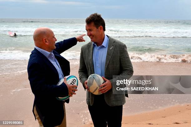 Rugby Australia interim chief executive Rob Clarke and New Zealand Rugby chief executive Mark Robinson pose for pictures on Manly Beach after a press...