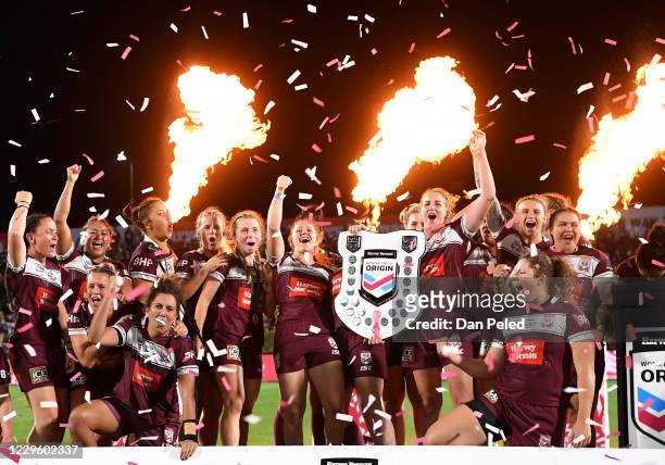Maroons players celebrate their win during the Women's State of Origin match between Queensland and New South Wales at Sunshine Coast Stadium on...