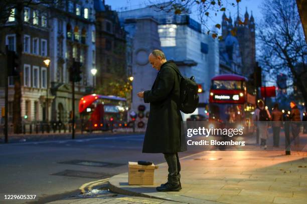 Dominic Cummings, special adviser to U.K. Prime minister Boris Johnson, waits with a box after departing from number 10 Downing Street in London,...