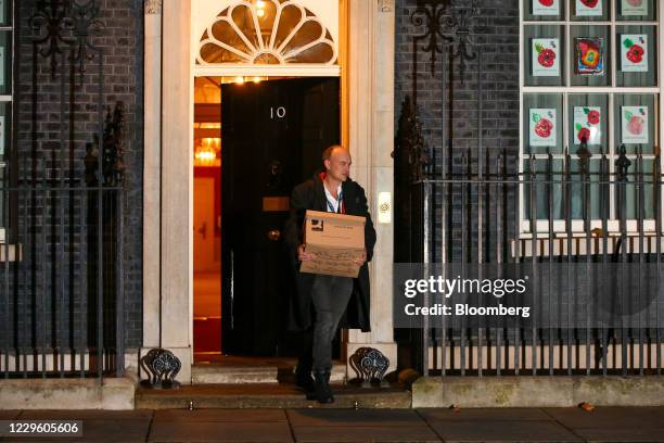 Dominic Cummings, special adviser to U.K. Prime minister Boris Johnson, carries a box as he departs from number 10 Downing Street in London, U.K., on...