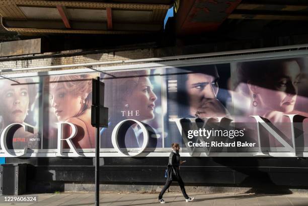 Panoramic billboard advertising the latest series of Netflix's 'The Crown' which is now airing on demand, shows the main characters of the British...