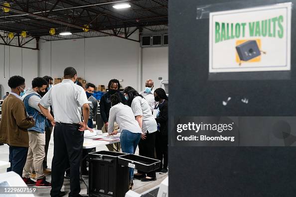 Hand Count Audit People are given instructions during a hand-count audit of 2020... News ...