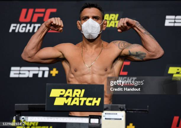 In this UFC handout, Rafael Dos Anjos of Brazil poses on the scale during the UFC weigh-in at UFC APEX on November 13, 2020 in Las Vegas, Nevada.