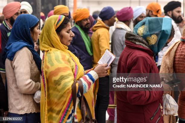 Sikh devotees gather to pay respect on the occasion of Bandi Chhor Divas, a Sikh festival coinciding with Diwali, the Hindu festival of light, at the...