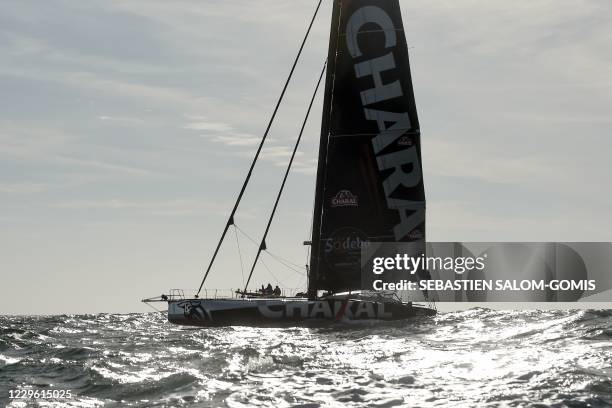 French skipper Jeremie Beyou sails his Imoca 60 monohull Charal as he returns in Les Sables-d'Olonne, western France, on November 14 to fix a badly...