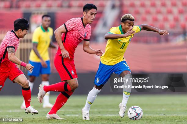 David Neres of Brazil is chased by Oh Sehun of Korea Republic during the match between Brazil U23 and Korea Republic U23 at Al Salam Stadium on...