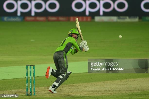 Lahore Qalandars Ben Dunk plays a shot during the Pakistan Super League Twenty20 cricket match between the Peshawar Zalmi's and Lahore Qalandars at...