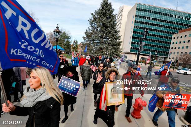 People gather at the Michigan State Capitol for a "Stop the Steal" rally in support of US President Donald Trump on November 14 in Lansing, Michigan....