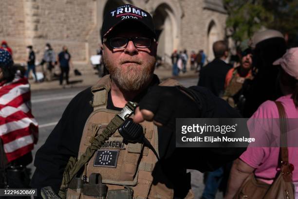 Member of the 3% militia group and supporter of President Trump, rallies against the election results outside the Georgia State Capitol on November...