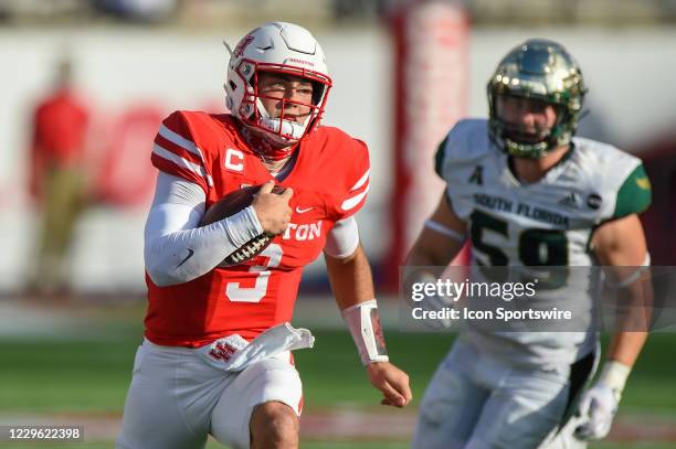 Houston Cougars quarterback Clayton Tune finds running room to the outside during the football game between the University of South Florida Bulls and...