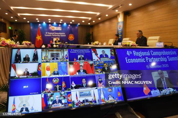 Vietnam's Prime Minister Nguyen Xuan Phuc is pictured on the screen as he addresses his counterparts during the 4th Regional Comprehensive Economic...