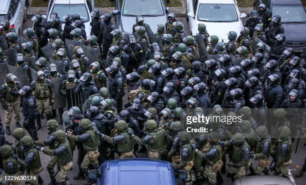 Law enforcement officers gather to disperse opposition supporters during a rally to protest against the Belarus presidential election results in...