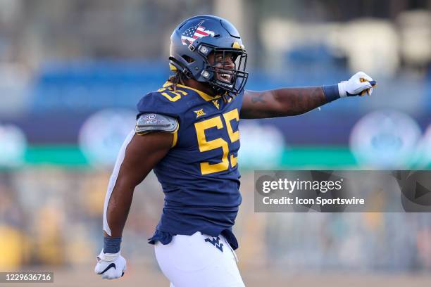 West Virginia Mountaineers defensive lineman Dante Stills celebrates after a Mountaineers sack during the fourth quarter of the college football game...