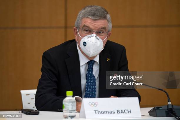 International Olympic Committee President Thomas Bach wears a face mask as he speaks during a press conference on November 16, 2020 in Tokyo, Japan....
