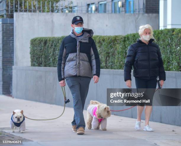 Deborra-lee Furness and Hugh Jackman are seen walking their dogs in SoHo on November 16, 2020 in New York City.