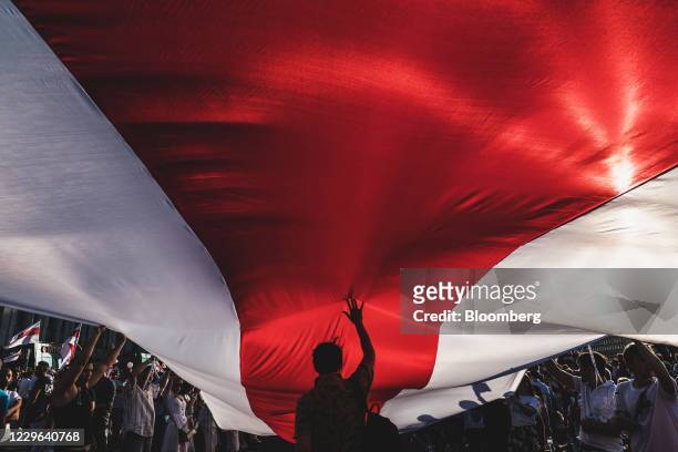 Bloomberg Best of the Year 2020: Protesters unfurl a banner in the colors of the former Belarus national flag as they call for the resignation of...