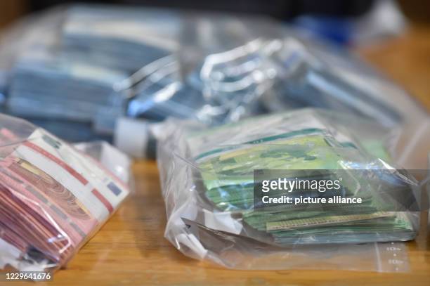 November 2020, Saxony-Anhalt, Magdeburg: Cash that was seized is in a police garage. The police officers from the State Criminal Police Office of...
