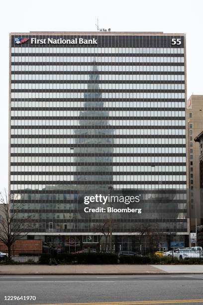 The Terminal Tower is reflected in the the First National Bank building in downtown Cleveland, Ohio, U.S., on Saturday, Nov. 14, 2020. On Sunday, the...