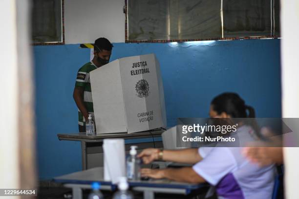 Man arrives to vote at a polling booth during municipal elections amid the Coronavirus pandemic in Santana, Amapá State, Brazil, on November 15,...
