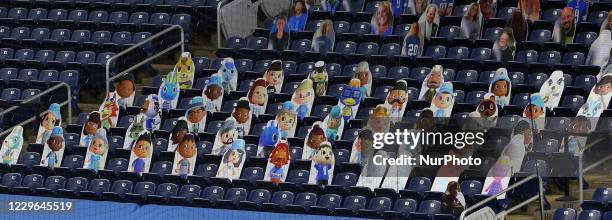 Cutout photos of characters from the online game Animal Crossing are placed in the spectator seating area near the endzone during the first half of...