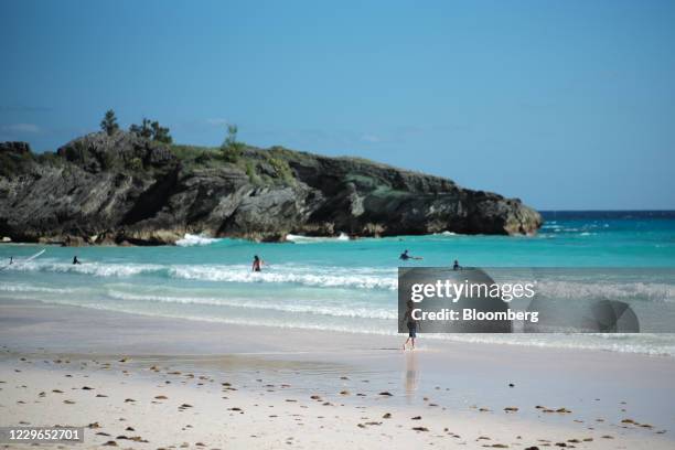 People visit Horseshoe Bay beach in Southampton, Bermuda, on Sunday, Nov. 15, 2020. With traditional tourism hammered by the pandemic and many in...