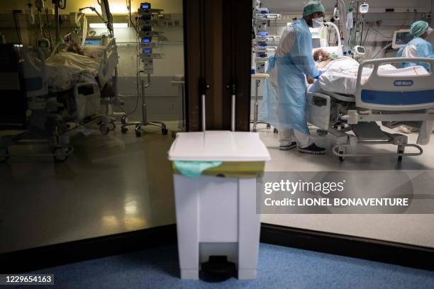 Medical personnel attend a Covid-19 patient at the intensive care unit of the clinic of Occitanie in Muret, near Toulouse, southern France on...