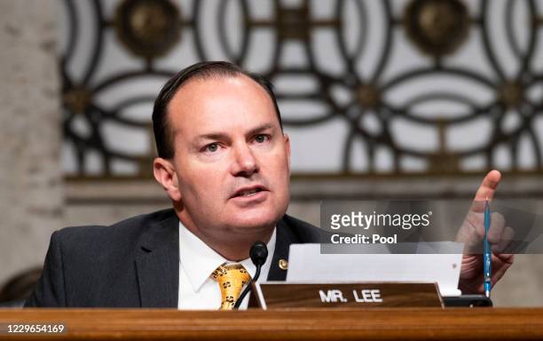 Sen. Mike Lee, R-Utah., questions Mark Zuckerberg, Chief Executive Officer of Facebook, and Jack Dorsey, Chief Executive Officer of Twitter, during...