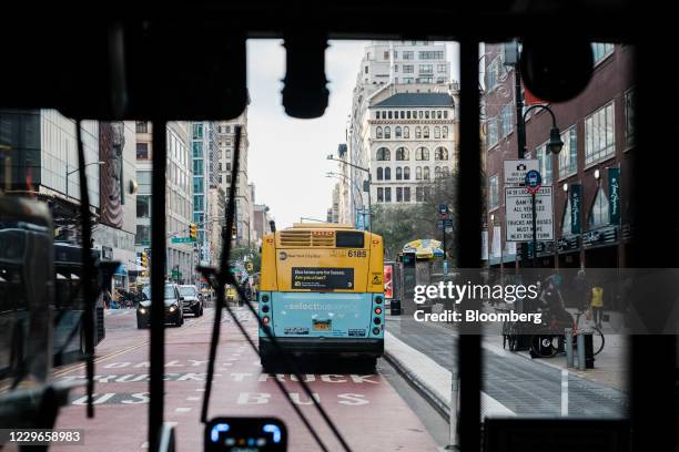 Buses travel along a street in New York, U.S., on Tuesday, Nov. 17, 2020. New York's Metropolitan Transportation Authority needs $12 billion of...