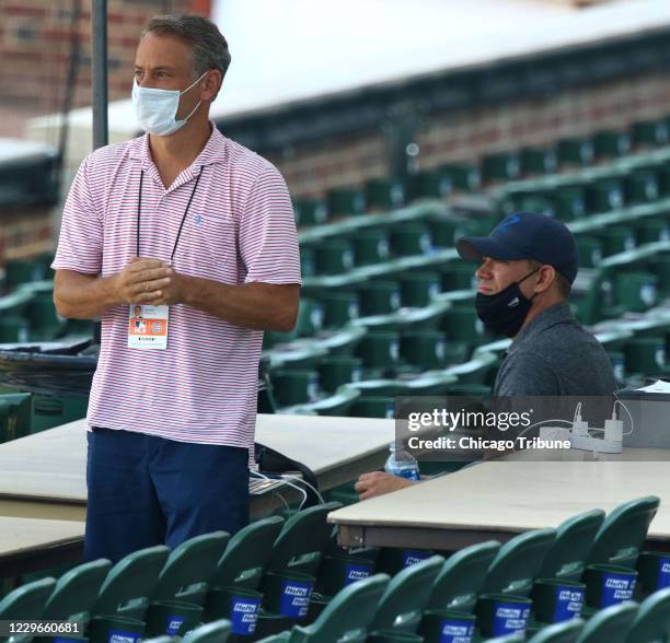 Chicago Cubs executives Jed Hoyer, left, and Theo Epstein watch during a team workout on July 4 at Wrigley Field in Chicago.