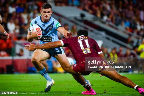 Queensland player Felise Kaufusi tackles New South Wales player Nathan Cleary during the State of Origin rugby league match between Queensland and...