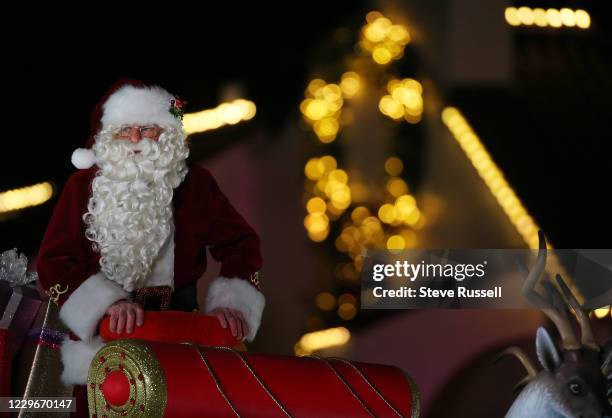 Santa Claus rides up on his float that features his eight reindeer lead by Rudolph. On a chilly night the Toronto Annual Santa Claus Parade which has...