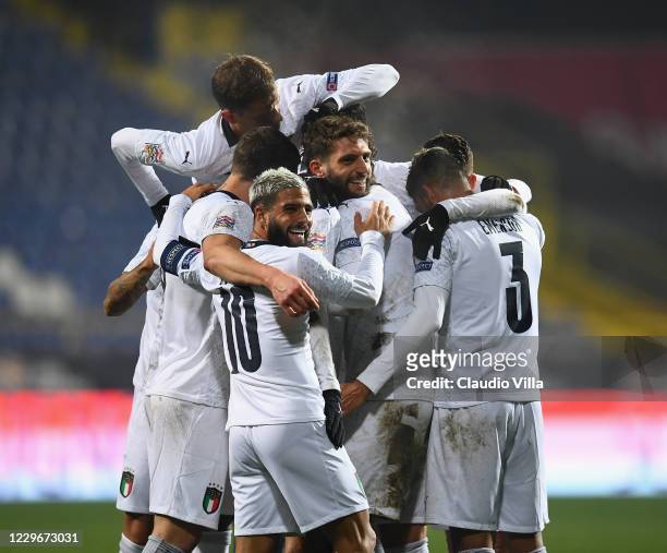 Domenico Berardi of Italy celebrates with team-mates after scoring the second goal during the UEFA Nations League group stage match between...