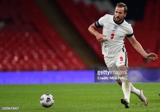 England's striker Harry Kane runs with the ball during the UEFA Nations League group A2 football match between England and Iceland at Wembley stadium...