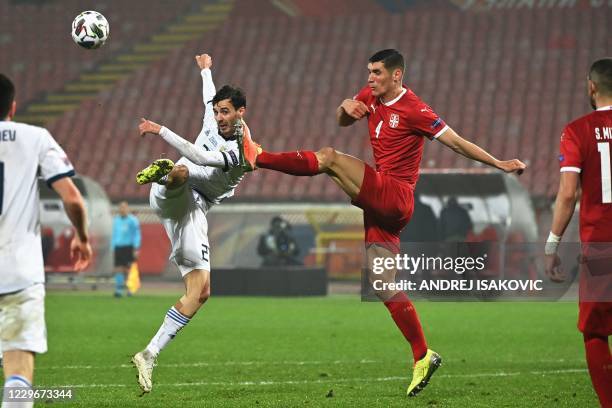 Russia's midfielder Aleksandr Erokhin vies with Serbia's defender Nikola Milenkovic during the UEFA Nations League Group B3 football match between...