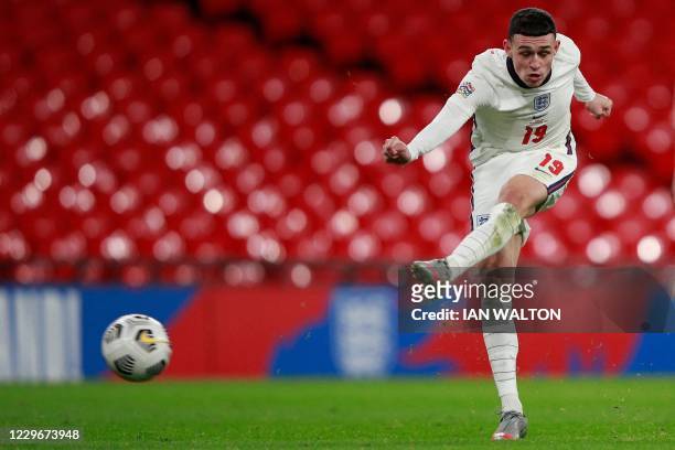 Englands's midfielder Phil Foden shoots to score his teams fourth goal during the UEFA Nations League group A2 football match between England and...