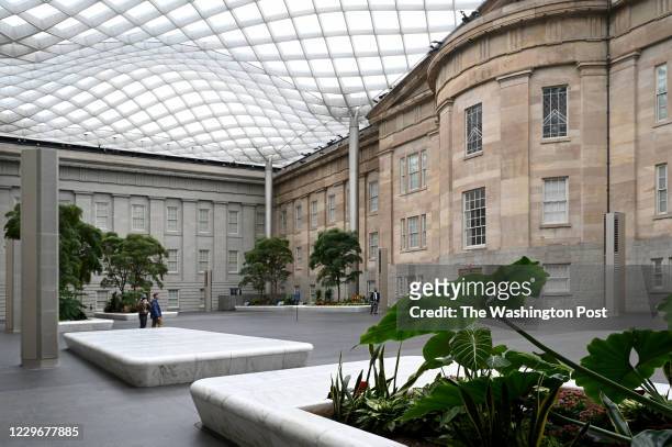 Tables and chairs have been removed from the Kogod Courtyard at the National Portrait Gallery and the Smithsonian American Art Museum, but patrons...